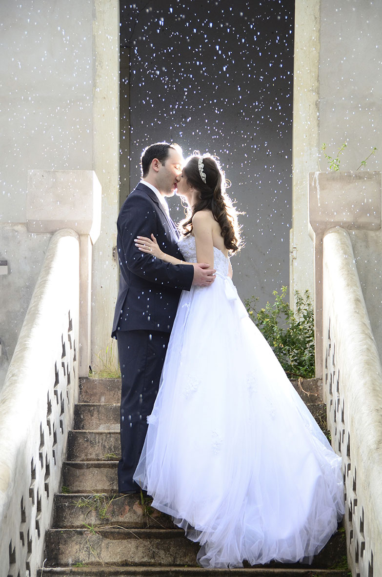 Photo of a bride and groom's first kiss.