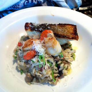 Photo of a seafood risotto with parmesan cheese, created by Beetham Food.