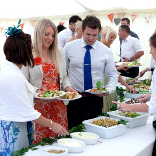 Photo of guests enjoying a wedding buffet catered by Beetham Food.