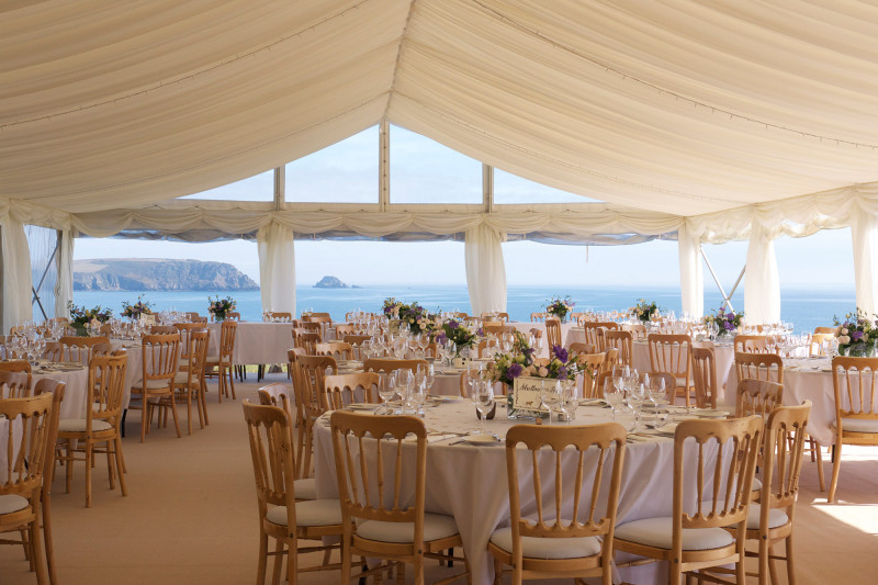 Shot of the scenery of the dining space by the coast, catered by Beetham Food.